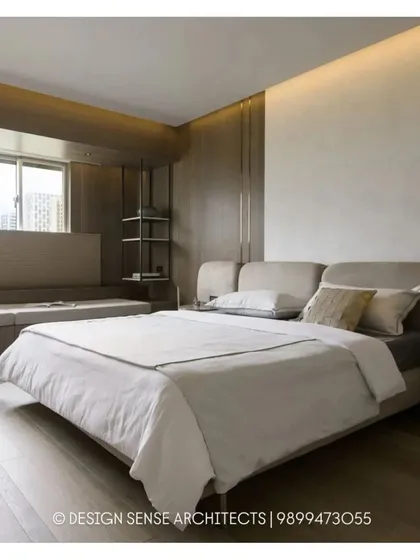 The realized version of our serene bedroom design, featuring a low-profile upholstered bed, a cozy window seat, and subtle metallic accents for a touch of understated luxury.