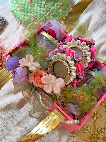 For the one who's been your first best friend and secret keeper. This Rakhi hamper is filled with beautiful floral and pearl details, perfect for your sister.