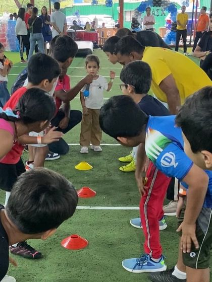 The intense focus before a game begins. We teach kids the rules and strategies of games like Kabaddi, ensuring they are ready for a fair and exciting match.