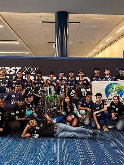 Team Kaizen celebrates their Engineering Excellence Award at the FIRST World Championship 2025, a remarkable achievement for a rookie team.