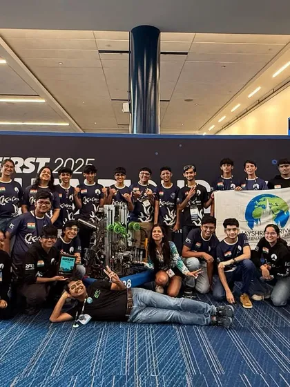 Team Kaizen 10428, in their rookie season, posing with their award-winning robot at the FIRST World Championship. Their success is a testament to our mentorship and their dedication to engineering excellence.