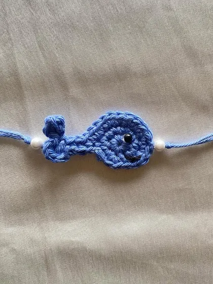 Our little blue whale Rakhi is a simple and sweet design for kids. It's lightweight and comfortable to wear, making it perfect for the festival.