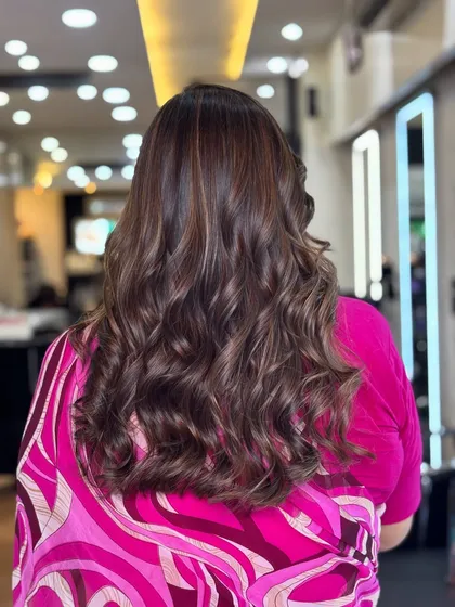 The back view of the curled mocha chocolate style. The harmony of warm and deep tones creates a flawless, glossy finish.