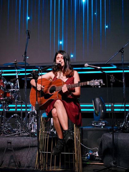 A full stage view with the drum kit and my band. Ready to bring the energy for a big indie gig.