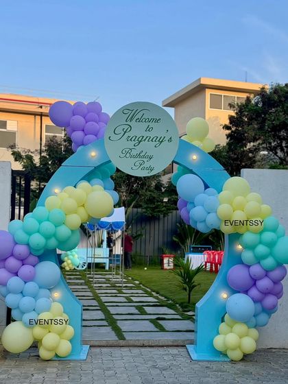 The welcome arch for the Cocomelon party, decorated with pastel balloons, leading guests into the fun.