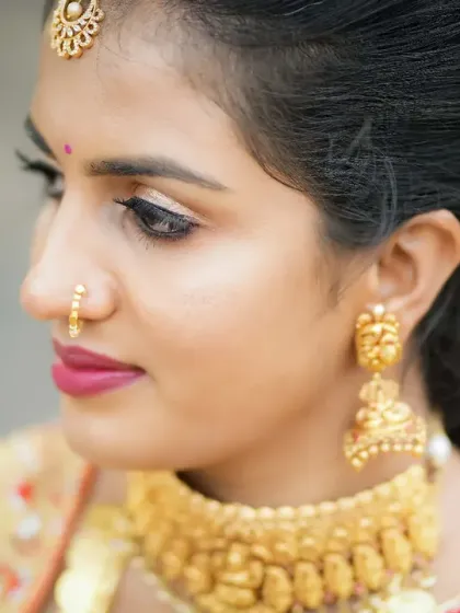 A close-up of a soft glam look. I focused on a sharp winged eyeliner and a subtle pink lip, a versatile style that works for everything from a sangeet to a formal dinner.