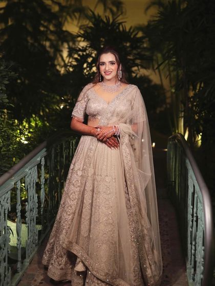 My bride Devyani looking so graceful on her reception night. The intricate work on her lehenga is matched with a classic makeup look.