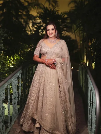 My bride Devyani looking so graceful on her reception night. The intricate work on her lehenga is matched with a classic makeup look.