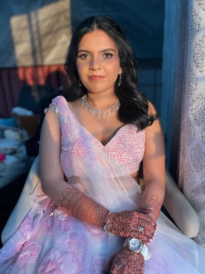 The final look, radiant and beautiful. The makeup is designed to look stunning both in person and in photographs.