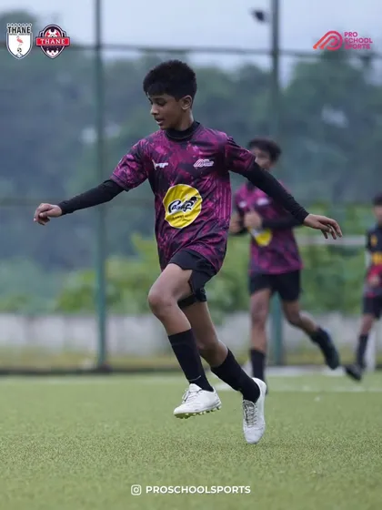A player shows agility and speed while on the ball during a match.
