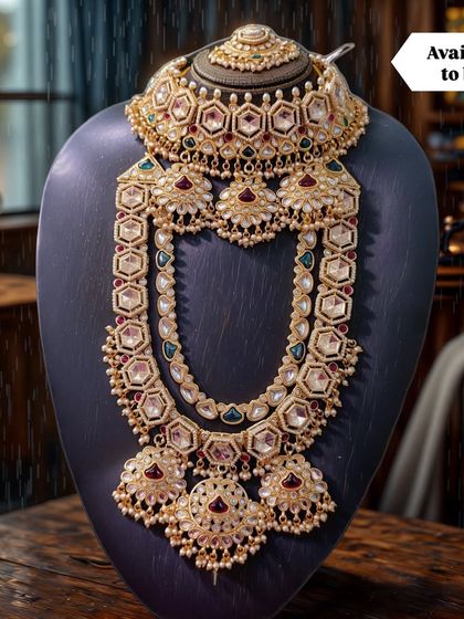 A beautifully styled shot of a complete bridal set available to buy. This heirloom-quality piece features a polki choker and a stunning rani haar, perfect for creating a memorable wedding look.