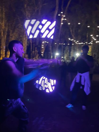 Another shot of the LED poi in action. The bright lights cutting through the darkness create a really cool, futuristic effect that always gets the crowd hyped.