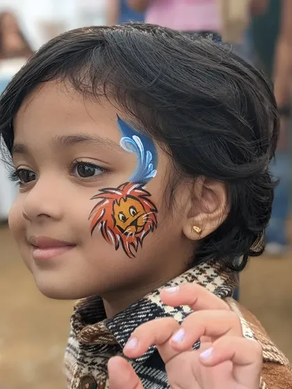 The same adorable lion design from a different angle, showing the child's happy expression.