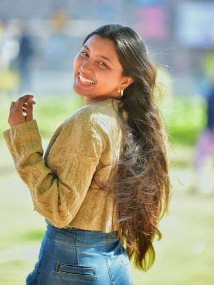 A slightly different take on the previous shot, this image captures another angle of her radiant smile and is a great option for a vibrant profile picture.