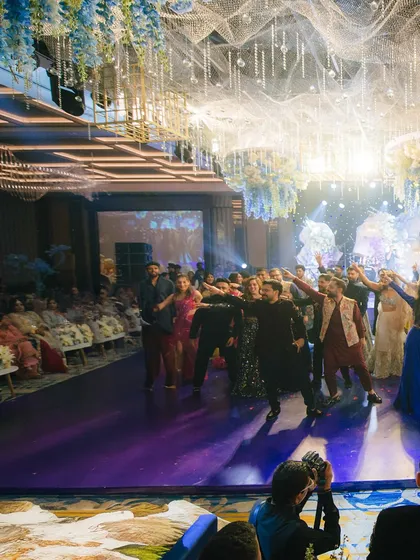 The entire family joins in for a group dance, filling the floor with energy and joy. These are the moments that bring everyone together in celebration.
