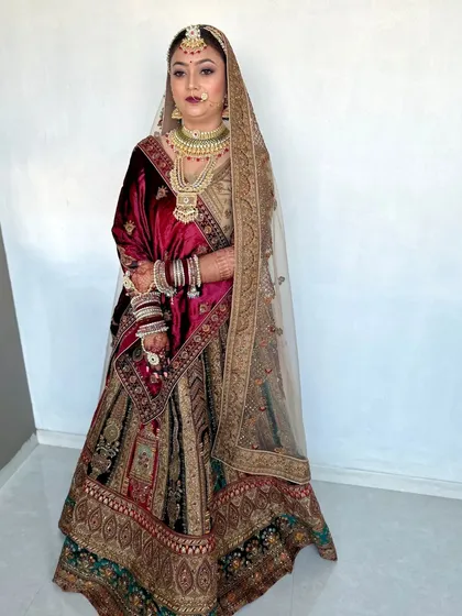 This bride is ready for her wedding day in a multi-toned velvet lehenga. I focused on creating a glowing complexion and defined eyes that complement her intricate jewellery and outfit.