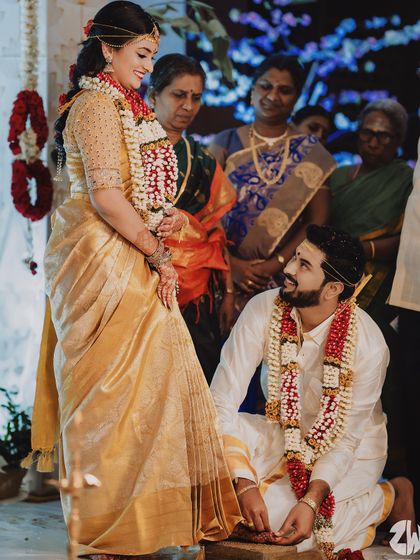 A collection of moments from bride Ishwarya's Muhurtham. Her golden wedding saree was draped to be both photogenic and practical for the various ceremonies of a traditional South Indian wedding.