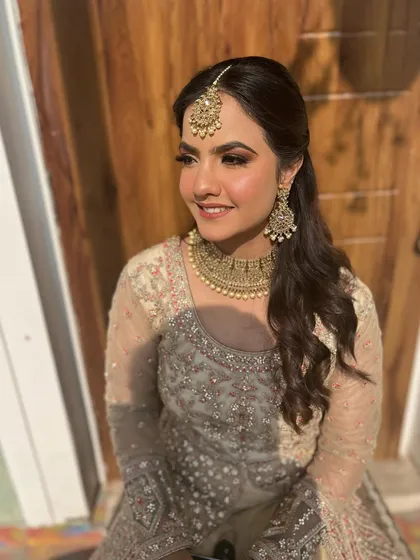 A happy, smiling shot. The makeup is designed to enhance her natural beauty and let her personality shine.