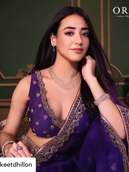 Another look from the same series, this time with a slightly different pose. The makeup remains the focal point, with a perfectly blended eyeshadow and a soft, matte lip.