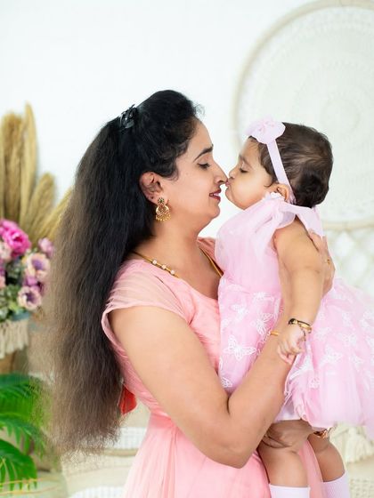 A sweet kiss between a mother and her baby girl. These are the tender, fleeting moments I love to freeze in time.