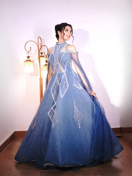 A full-length view of this stunning blue fairytale gown.