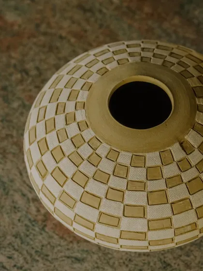 A collection of Prady's finished sgraffito and slip-work pots. His precision with geometric and floral patterns on rounded forms is just incredible.