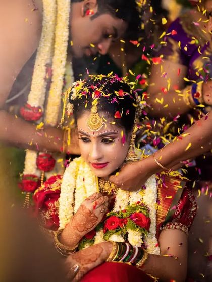 A sacred moment during the wedding ceremony, as the groom ties the Mangalsutra. We capture these crucial rituals with reverence and artistry.