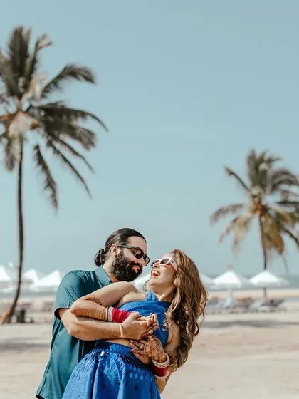 A moment of pure laughter and joy on the beach. These unposed, happy moments are what make a pre wedding shoot truly special and personal.