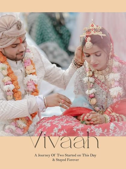 The groom applies sindoor to the bride's hair parting, a significant and emotional ritual of the Hindu wedding ceremony.