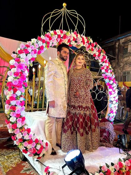 This photo captures the couple standing on the Crown entry platform, giving you a clear view of how the entire setup looks with the bride and groom as the centerpiece.