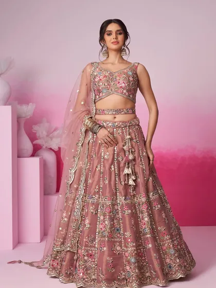 Soft, elegant, and perfect for a daytime wedding or engagement. This dusty pink lehenga features delicate multi-color floral embroidery. It’s a beautiful example of the pastel outfits for rent in my collection.