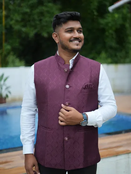This client is wearing our deep wine-colored waistcoat. The rich color and texture make it a great choice for an evening function or a festive family gathering.