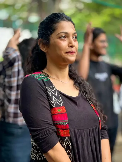 A moment of graceful focus during our dance workshop. Our community gatherings are a mix of high-energy fun and moments of artistic expression.