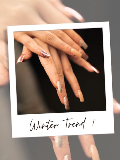 This winter wedding look features long, coffin-shaped nails with a mix of metallic chrome, nude, and glitter finishes. It's a modern and glamorous choice for a bride or wedding guest.