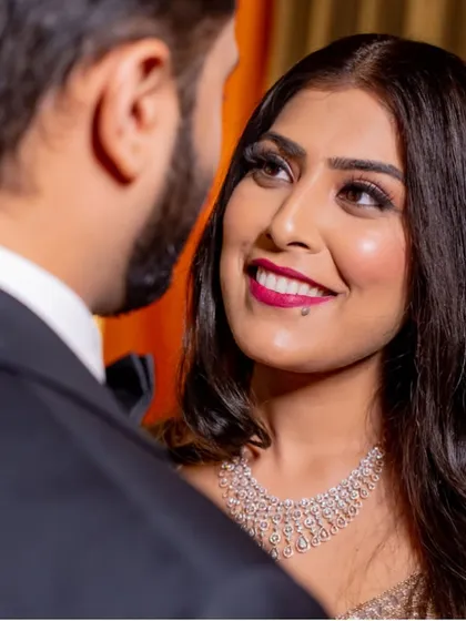 A beautiful close-up of the bride looking at her husband.