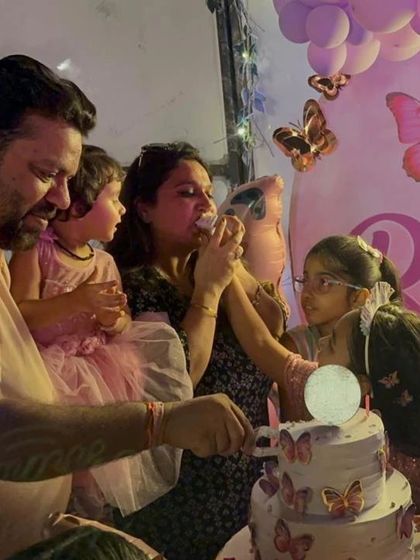 Capturing the happy moments. The birthday girl and her family cutting the cake in front of the beautiful butterfly-themed backdrop I created.