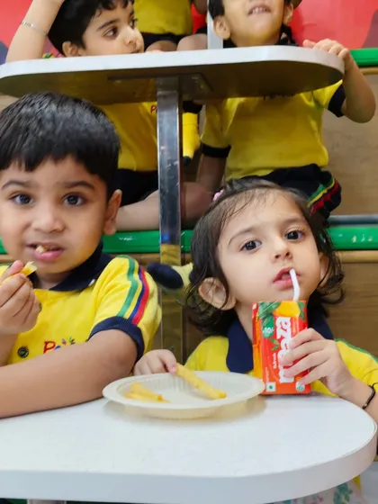 Refueling with some fries and juice. Our kid-friendly menu is a hit with students, providing the energy they need for an afternoon of play.
