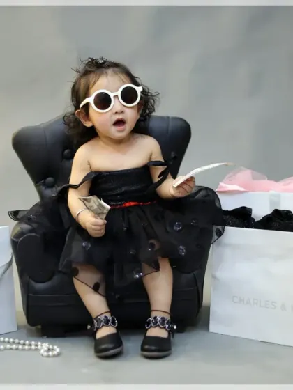A little fashionista's shopping spree! This fun and stylish theme features a miniature armchair, shopping bags, and chic accessories for a glamorous photoshoot.