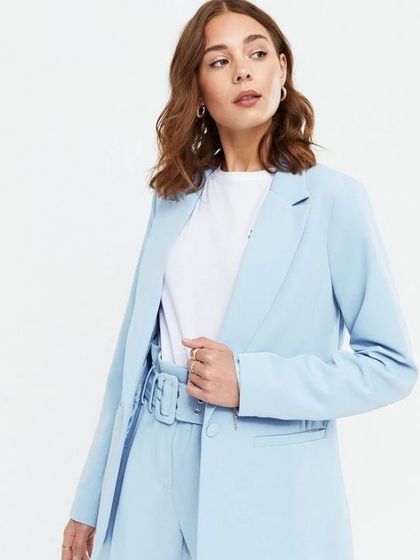 I believe in affordable luxury. This light blue power suit shows you can get a high-quality, custom-fit look without the high-end price tag.