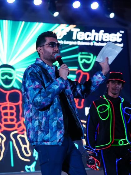 Another shot with the Illuminati crew, highlighting the futuristic and tech-focused theme of the event.