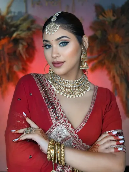 A timeless classic red bridal look. We teach our students to master every detail, from the flawless HD base and sharp winged liner to the perfect traditional styling.