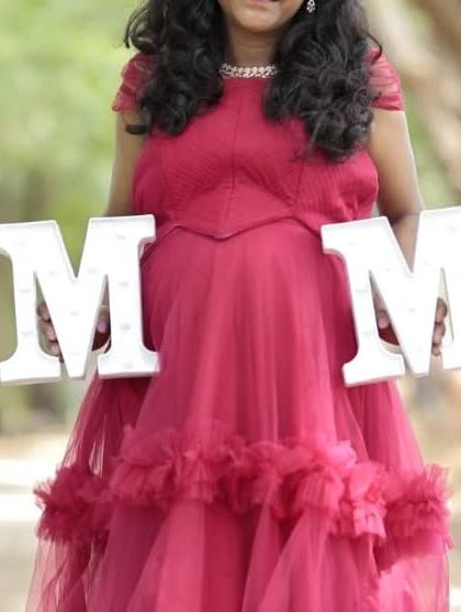 This pink ruffle gown is one of my most budget-friendly rental options. It's perfect for capturing those sweet "Mom" moments during your maternity shoot.