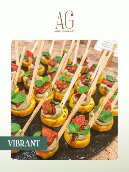 Vibrant and flavor-packed. These canapés, featuring a creamy purée and sun-dried tomato on a polenta-like base, are the ultimate party starters for any catered event.