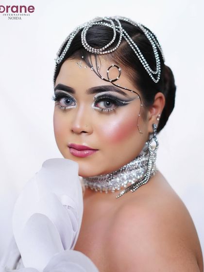 This portrait highlights the intricate line work on the face and the sparkling, custom-made choker.