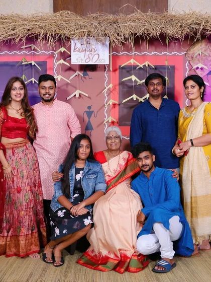 A beautiful family portrait from the 80th birthday celebration. Our themed backdrops are designed to be large enough for group photos, ensuring no one is left out of the memories.