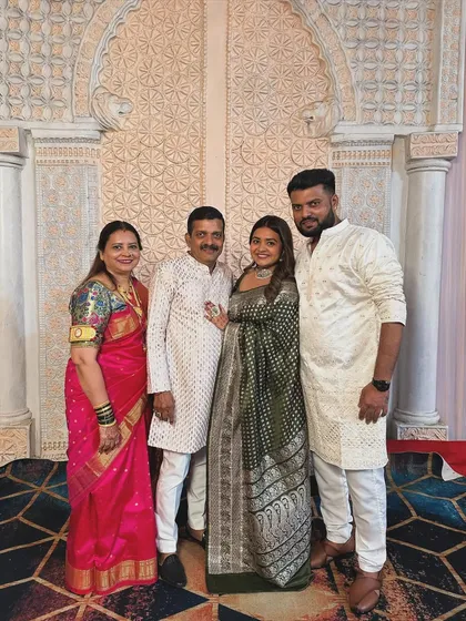 A precious family photo. Me with my parents and brother, wearing my mother's wedding saree. Family is my anchor and my biggest support system.