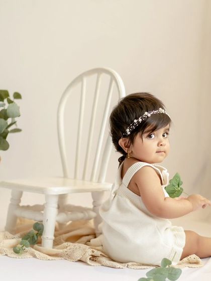 A different angle of this sweet sitter session. The simple props keep all the focus on her beautiful face.