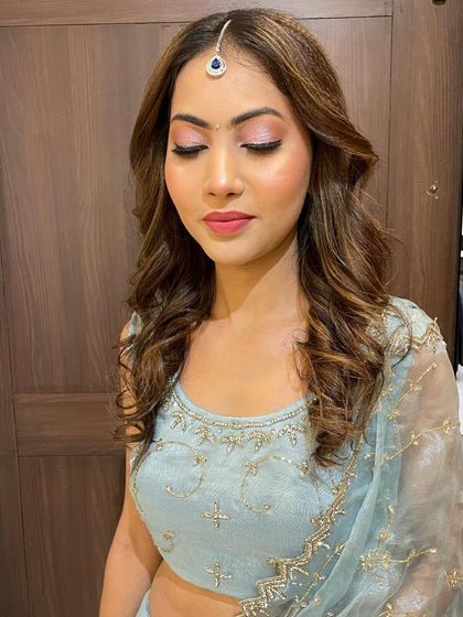 A close-up of the soft glam makeup, featuring pink-toned eyeshadow and a natural, glowing complexion.