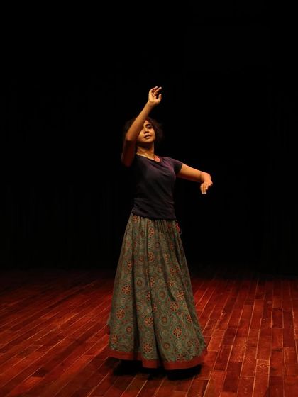 A dancer in a moment of movement during a tech run.