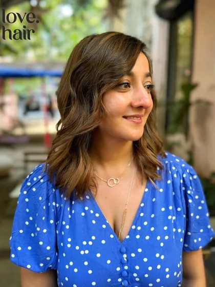The client looking sweet and stylish with her new short haircut and custom balayage color.